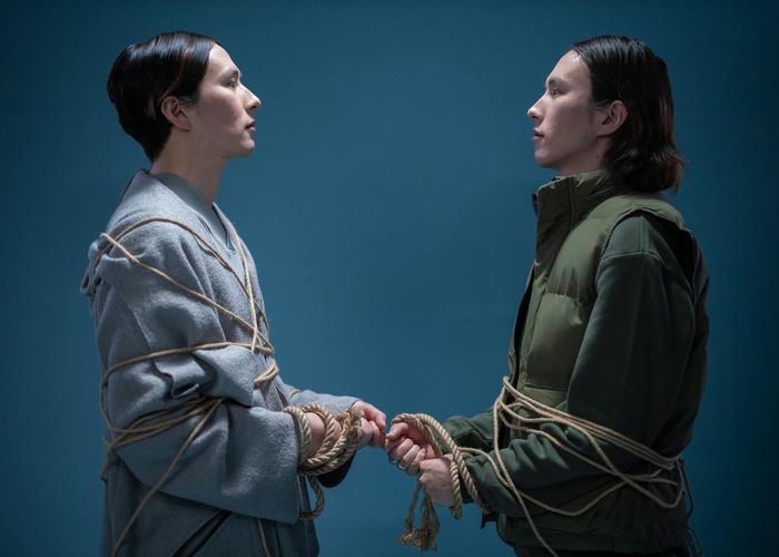 Group of men encouraging each other during a workout, showing community spirit.